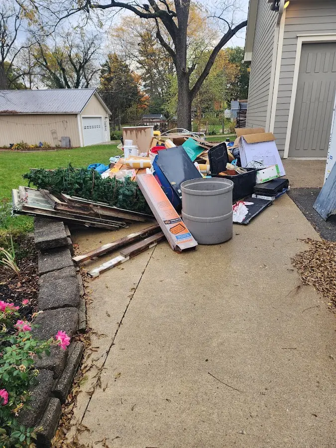 Dumpster being loaded with debris for Residential Dumpster Rental in Newberry